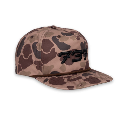 old school Camouflage-patterned cap with a black logo on a white background